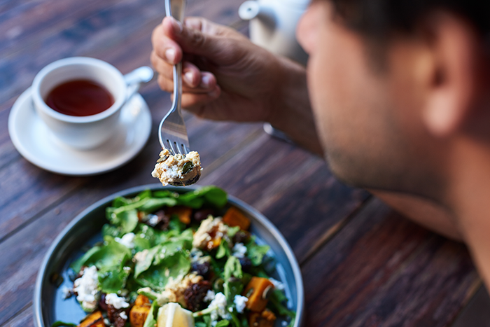 person eating a salad