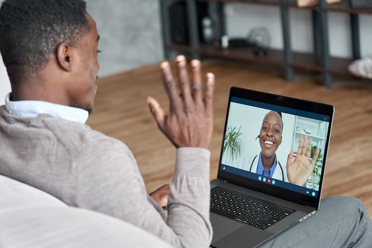 man doing virtual visit with primary care provider